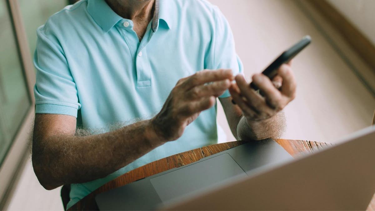 man working on cellphone