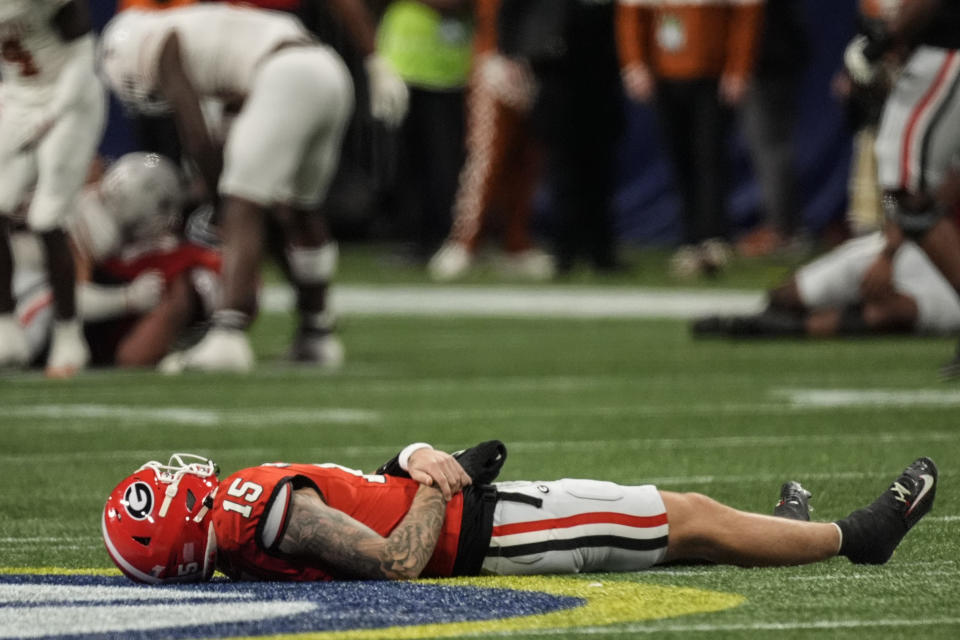 Carson Beck was injured late in the first half of the SEC championship. (AP Photo/John Bazemore)