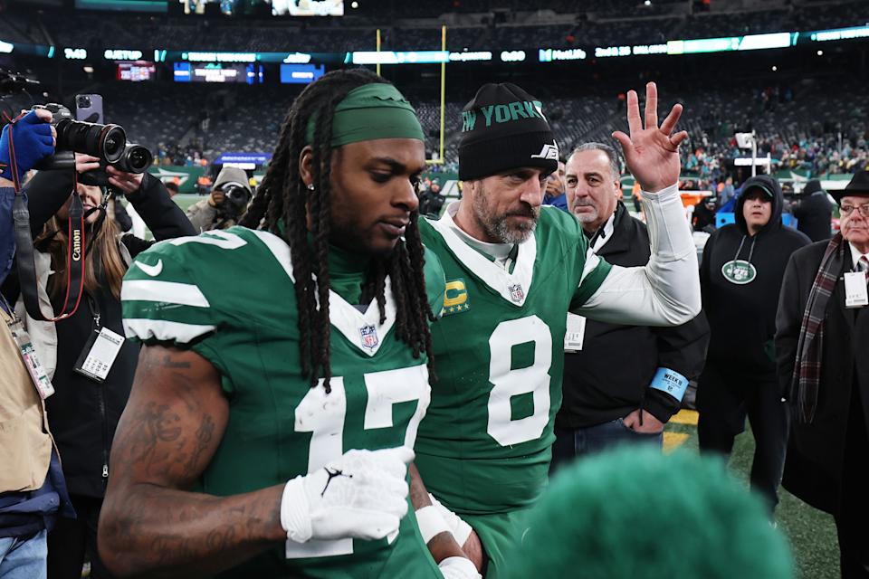 EAST RUTHERFORD, NEW JERSEY - JANUARY 05: Aaron Rodgers #8 and Davante Adams #17 of the New York Jets leave the field after beating the Miami Dolphins 32-20 at MetLife Stadium on January 05, 2025 in East Rutherford, New Jersey. (Photo by Luke Hales/Getty Images)