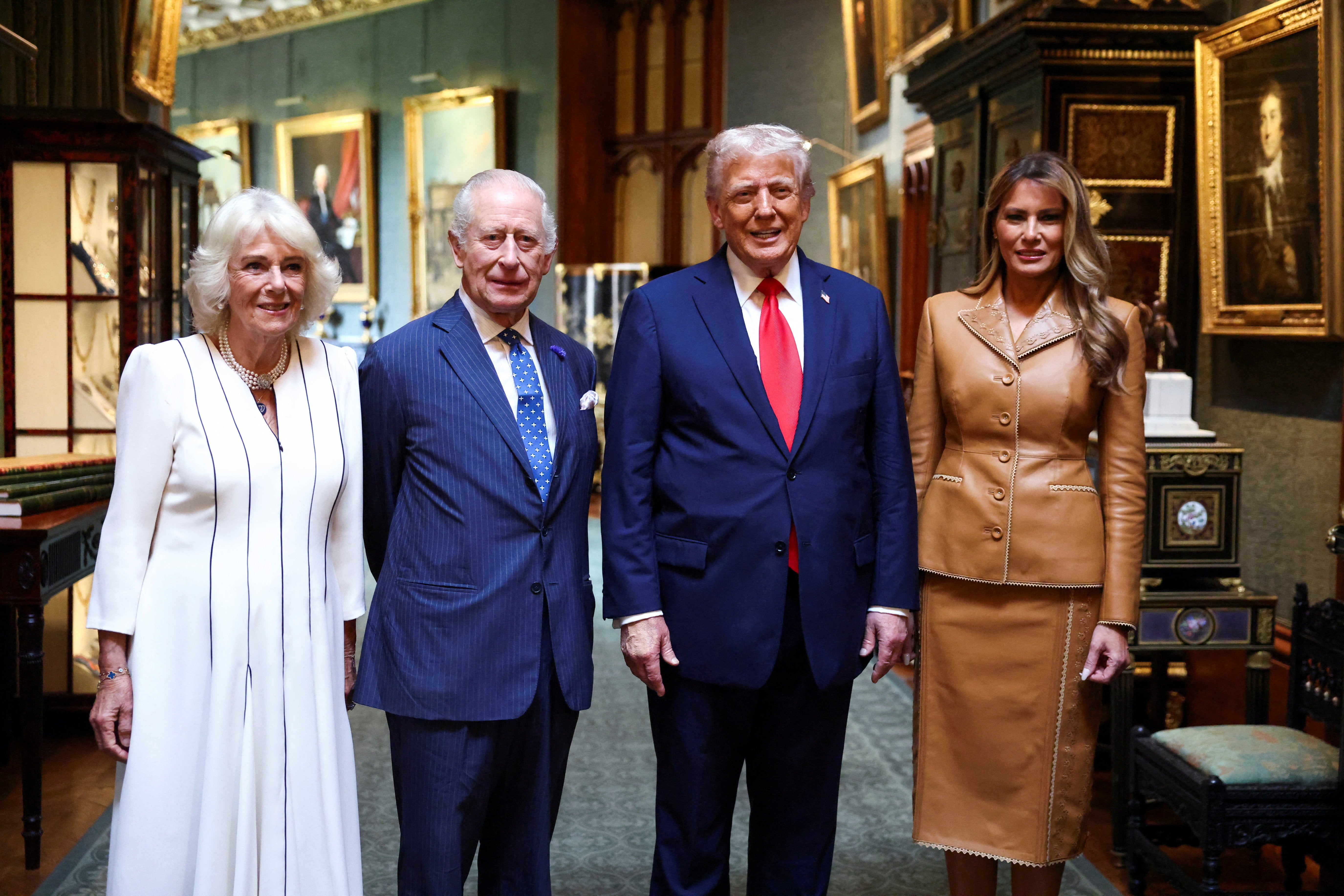 US President Donald Trump and first lady Melania Trump stand next to Britain's King Charles and Queen Camilla as they bid their farewells while they depart Windsor Castle