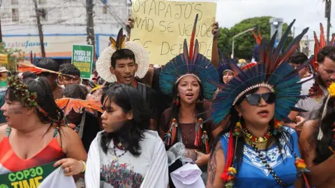 Reuters Protesters at a march in Belem, Brazil, near the COP30 climate summit. 