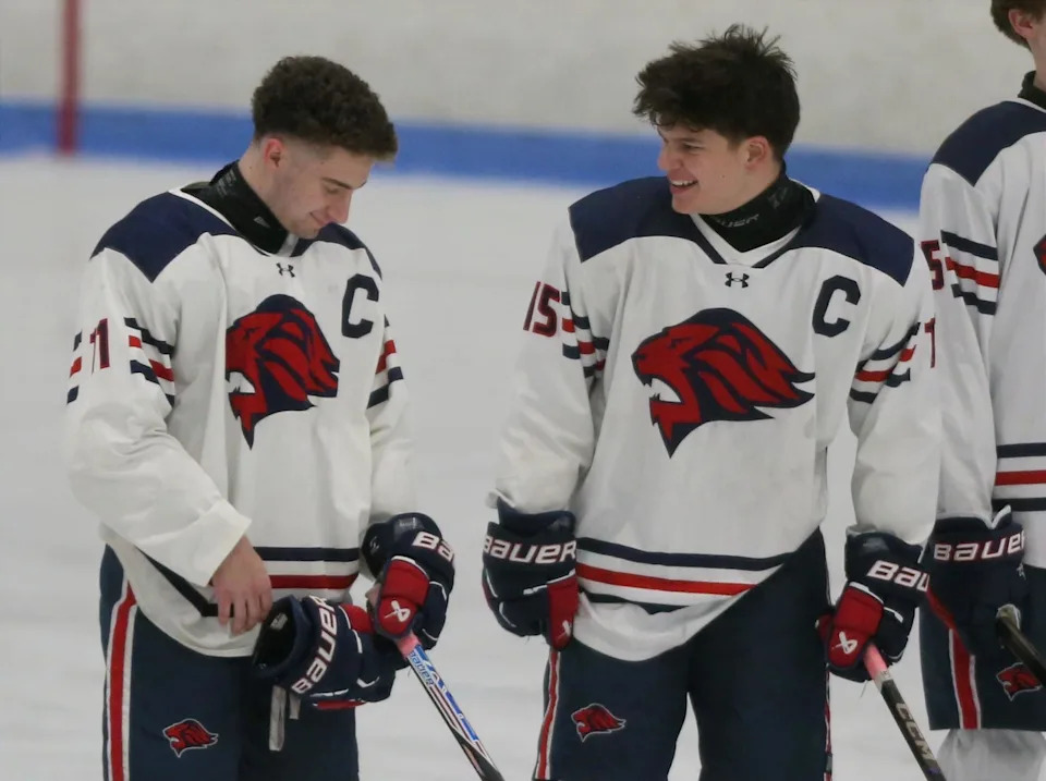 Tyler Almeida (left) and Nicholas Pelosi, Lincoln boys hockey